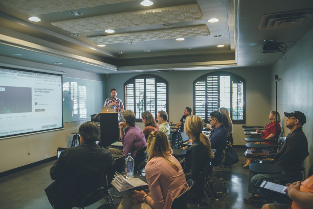 Adults seated at a professional-development workshop watching a presenter